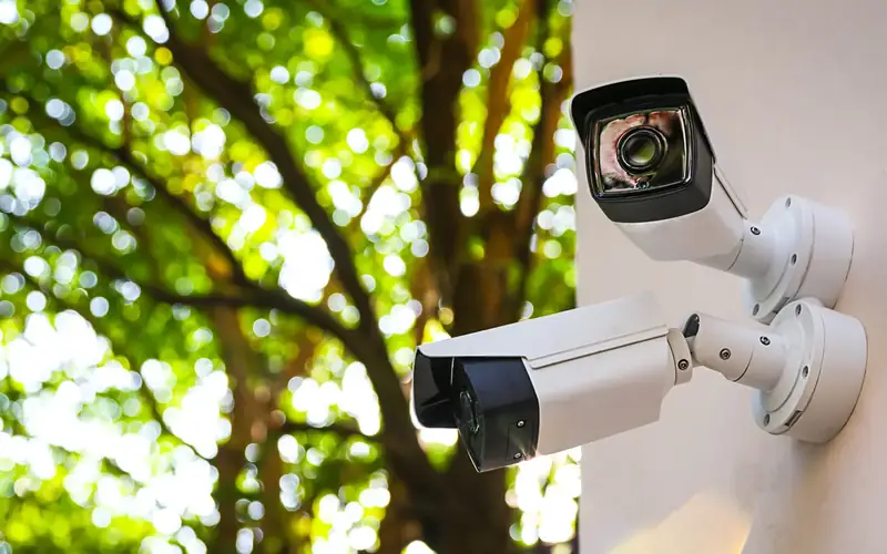 Security cameras mounted on an exterior wall